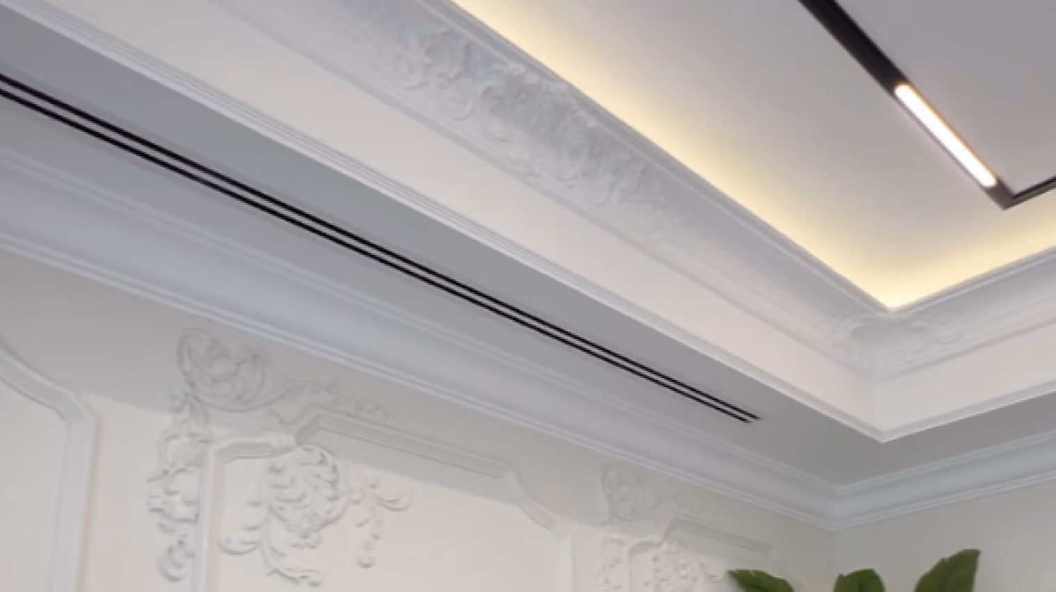 Brow & Beauty salon ceiling with recessed cove lighting and decorative mouldings