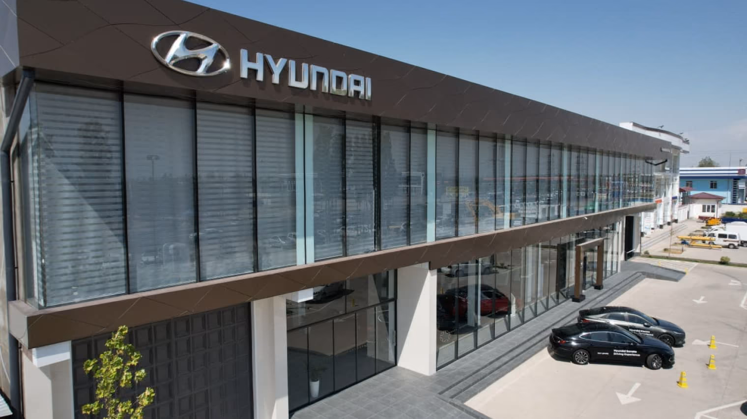Hyundai dealership exterior with a long glazed showroom façade